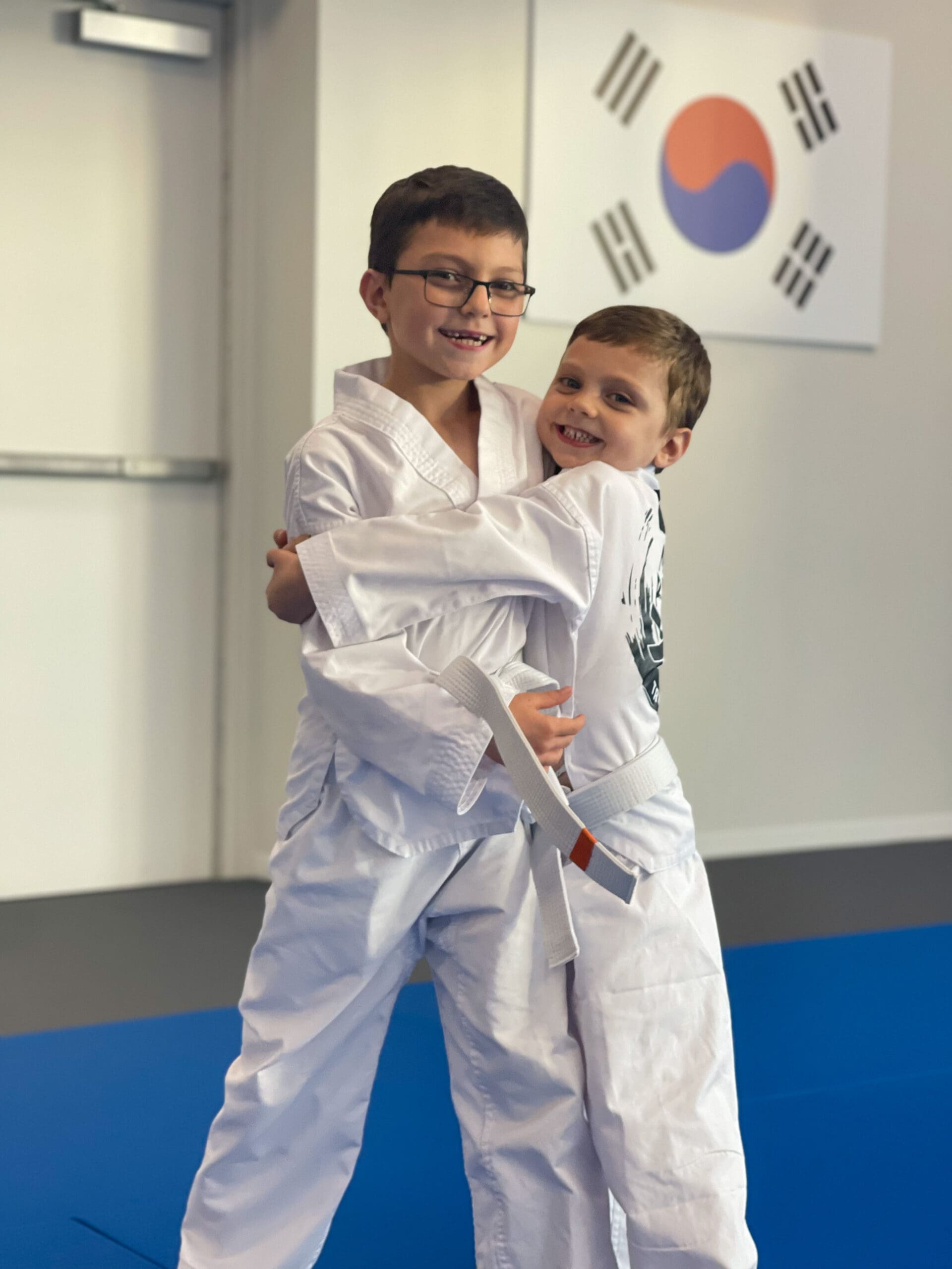 World Taekwondo for preschool children ages 2-5 teaches self-defense, important values, and new techniques while ensuring safety with protective gear, allowing students to progress by breaking wooden boards and mastering various aspects of Tae Kwon Do.
