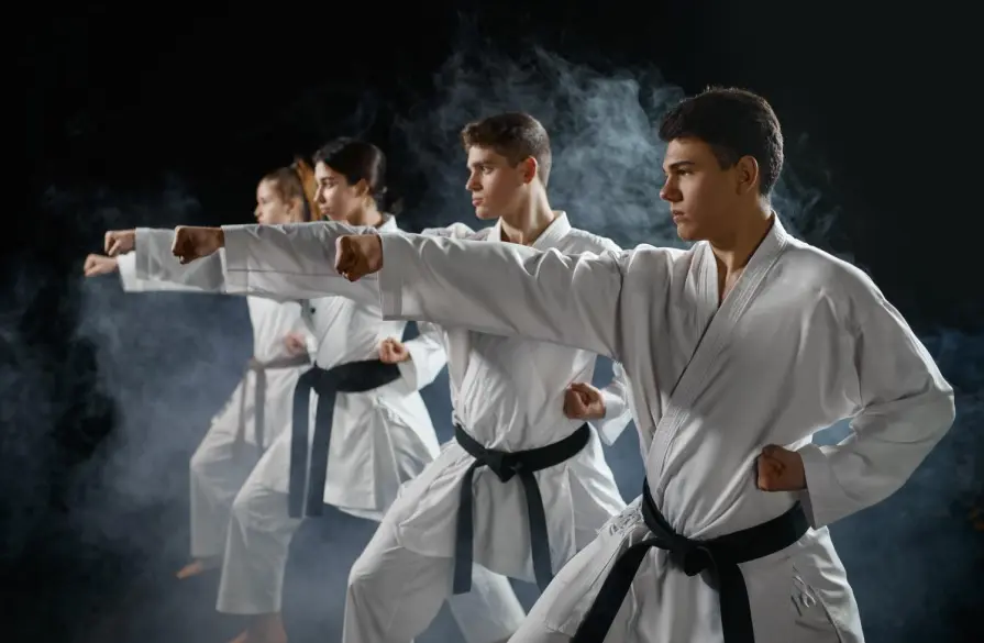 At our taekwondo school, young people wear the traditional taekwondo uniform as they practice different techniques such as the hook kick, all while working toward a black belt and learning the importance of focus, achieving goals, and improving self-esteem.