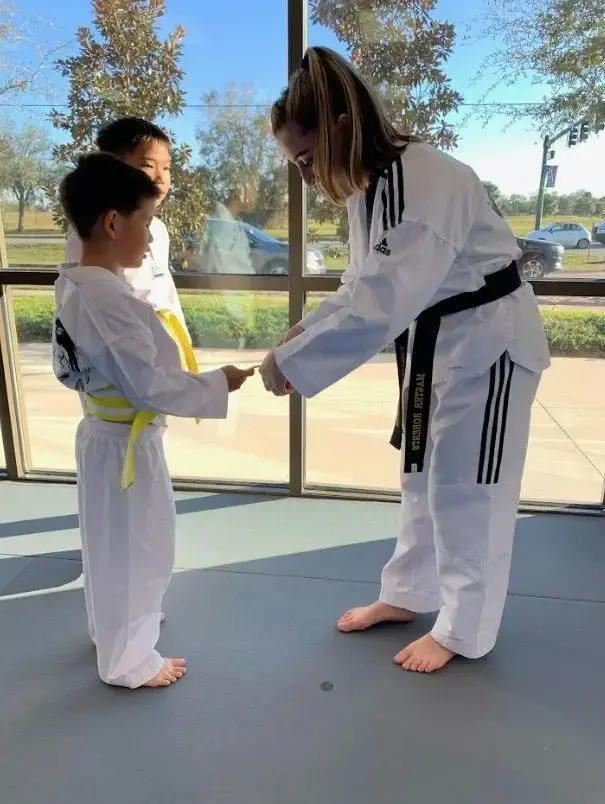 child belt promotion ceremony in a martial arts class
