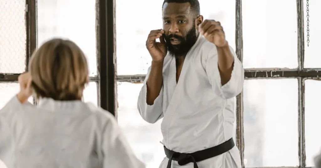 Instructor demonstrating a punch with student during taekwondo practice tips